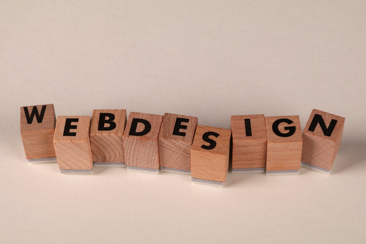 Crafting Captivating Headlines: Your awesome post title goes here Wooden blocks spelling 'web design' creatively showcase digital design concept.